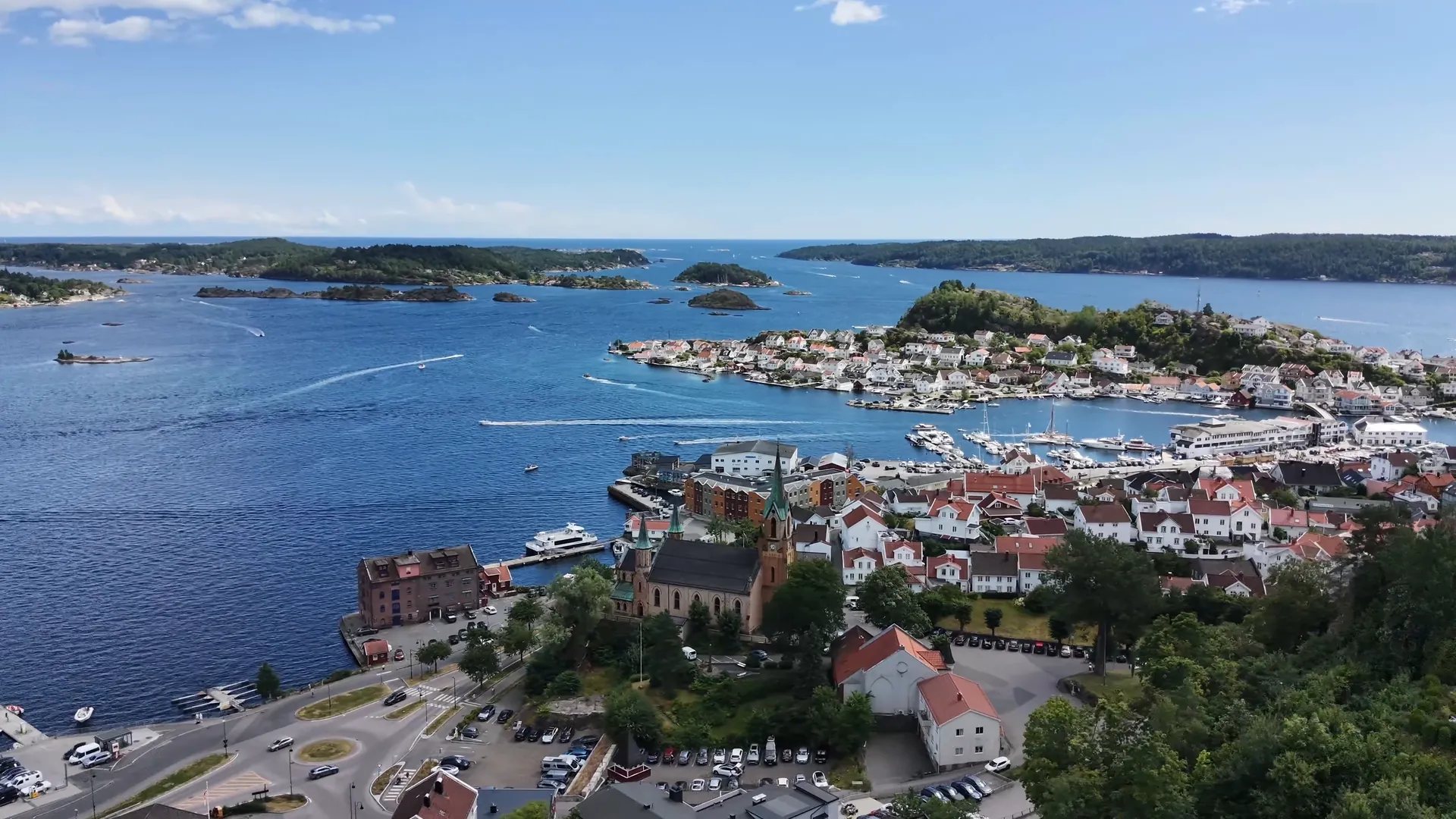 Kragerø Church among red-roofed houses, seen from the air